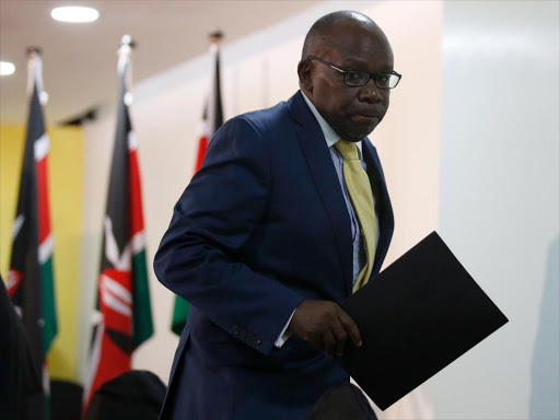 Attorney General Githu Muigai leaves the press conference where he said that the Government of Kenya will not eff ect the arrest warrants by ICC of Walter Baraza, Paul Gicharu and Philip Kipkoech Bett. / JACK OWUOR