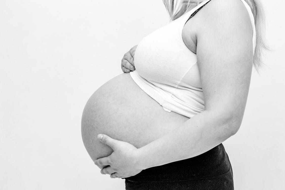 Woman Holding Her Baby Bump