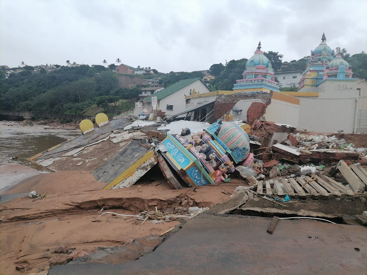 Parts of the historic temple collapsed and were washed away during Monday's torrential rains.