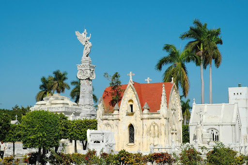 Necrópolis de Cristóbal Colón, a national monument in Havana and one of the largest cemeteries in the Americas, is renowned for its striking religious iconography and elaborate marble statues.  