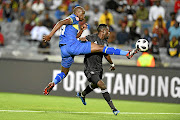 Kwanda Mngonyama of Cape Town City wins the ball ahead of  Pirates' Augustine Mulenga during their Absa Premiership match  at Orlando on Thursday.  