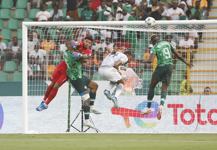 Nigeria's William Troost-Ekong and Victor Osimhen in a goal-mouth melee against South Africa goalkeeper Ronwen Williams and Mothobi Mvala
