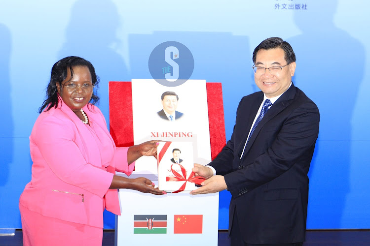 Tourism, Wildlife, and Heritage Cabinet Secretary, Peninah Malonza with Minister of culture and tourism in China, Hu Heping, during the launch ceremony for the Swahili edition of Xi Jinping: The Governance of China ( volume 1) at University of Nairobi on August 14, 2023.