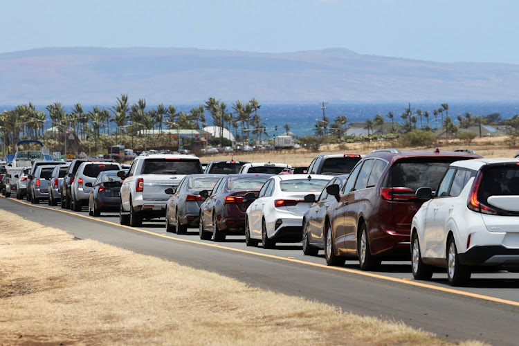 Vehicles on Honoapiilani highway after officials allowed residents and tourists back into West Maui after a wildfire destroyed the historic town of Lahaina on August 11, 2023.