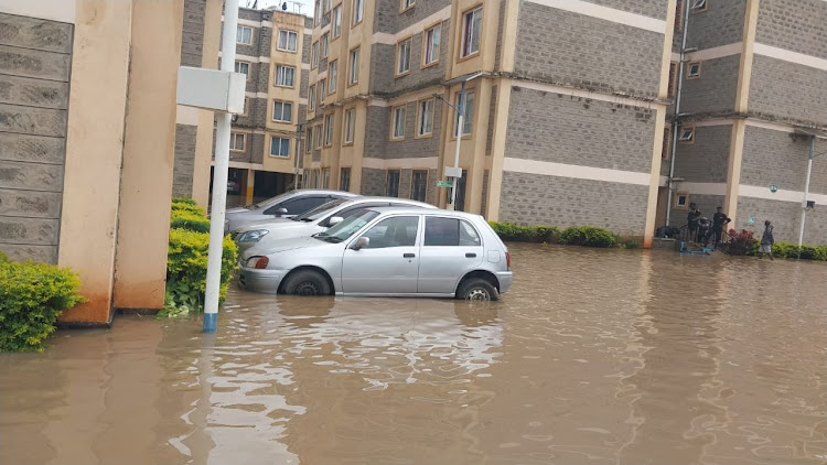 Vehicles marooned in water after heavy downpour in Machakos on April 21, 2024