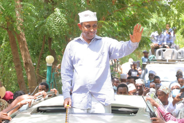 Garissa Governor Ali Korane waves to his jubilant supporters at Iftin moments after being endorsed by the Awdhaq council of elders to the sole candidate for the position of governor the 2022 general election.