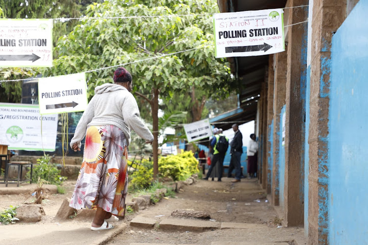 A voter leaving after casting her vote at Kbera primary polling station./Victor Imboto