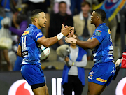 Courtnall Skosan (leftt) of the Stormers celebrate after scoring a try with Warrick Gelant during the United Rugby Championship match against Zebre at Danie Craven Stadium on December 02, 2023