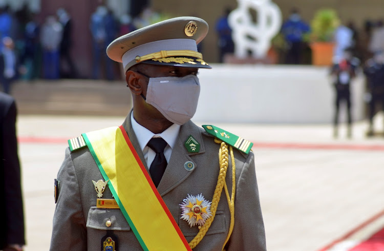 Colonel Assimi Goita, leader of two military coups and new interim president, walks during his inauguration ceremony in Bamako on Mali June 7, 2021. Col. Sadio Camara was one of the leaders of an earlier coup in August last year that ousted then-President Ibrahim Boubacar Keita.