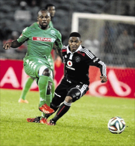 EYES ON THE BALL: Thandani Ntshumayelo of Orlando Pirates, right, fights for the ball with AmaZulu's Nhlanhla Shabalala during their Absa Premiership match at Orlando Stadium last night PHOTO: ANTONIO MUCHAVE