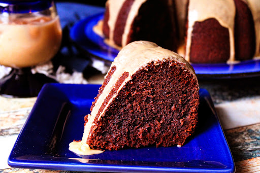 A slice of Kahlua Chocolate Cake on a plate.