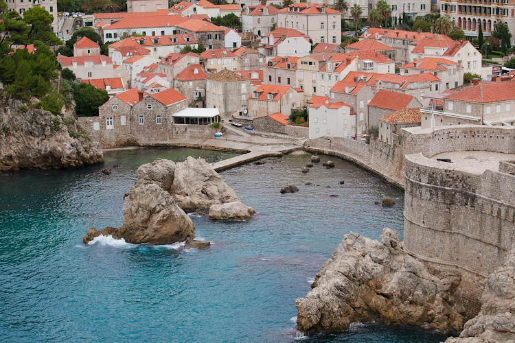 The bay meets the edge of Dubrovnik and its charming orange-clad clay rooftops. 