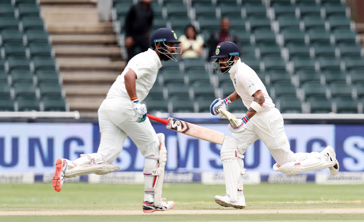 Virat Kohli and Cheteshwar Pujara of India during the 2018 Sunfoil Test Series match between South Africa and India at Wanderers Stadium, Johannesburg South Africa on 24 January 2018.