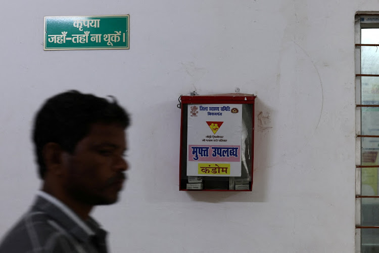 A man walks past a free condom dispenser at a community health centre in Bahadurganj subdivision of Kishanganj district, Bihar, India, on March 21 2023. Picture: REUTERS/ANUSHREE FADNAVIS