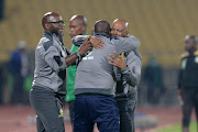 Mamelodi Sundowns coaches Steve Komphela and Manqoba Mngqithi celebrates during the Nedbank Cup final match between Mamelodi Sundowns and Marumo Gallants FC at Royal Bafokeng Stadium on May 28, 2022 in Rustenburg.