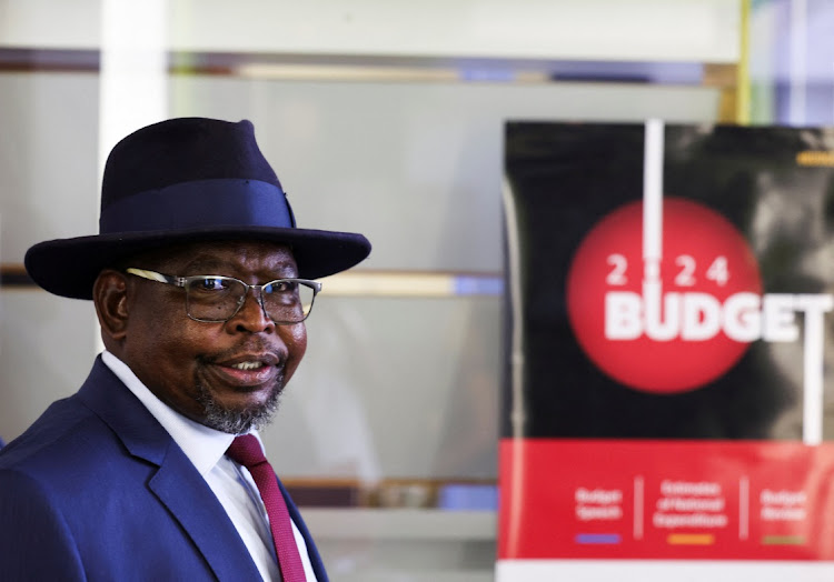 Finance minister Enoch Godongwana looks on after a press conference ahead of his 2024 budget speech in Cape Town.