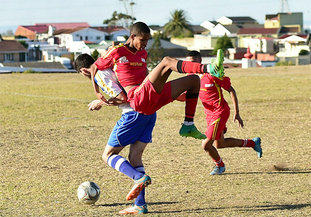 West lake’s Clint Laatz, top, and Ramblers’ Shaakir Abrahams tussle for the ball in their match at the Malabar Sports Fields on Sunday