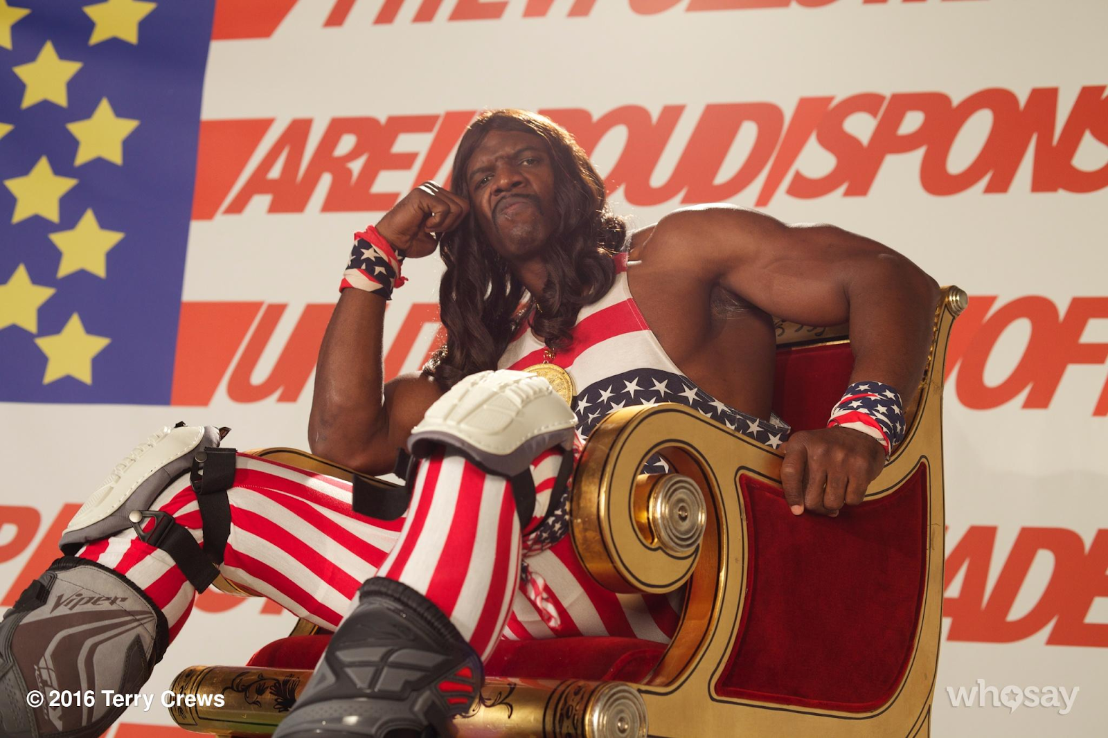 Terry Crews in his Herbert Camacho costume, an American-flag themed jumpsuit. He also has a magnificent wig and mustache. 