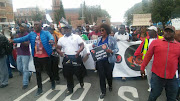 Dr Makhosi Khoza marching with security guards in Germiston.