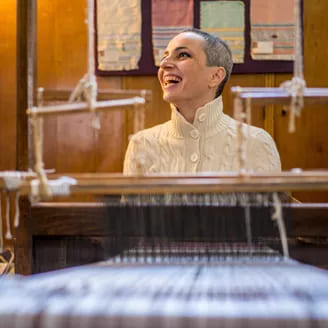 smiling-woman-with-loom.jpg