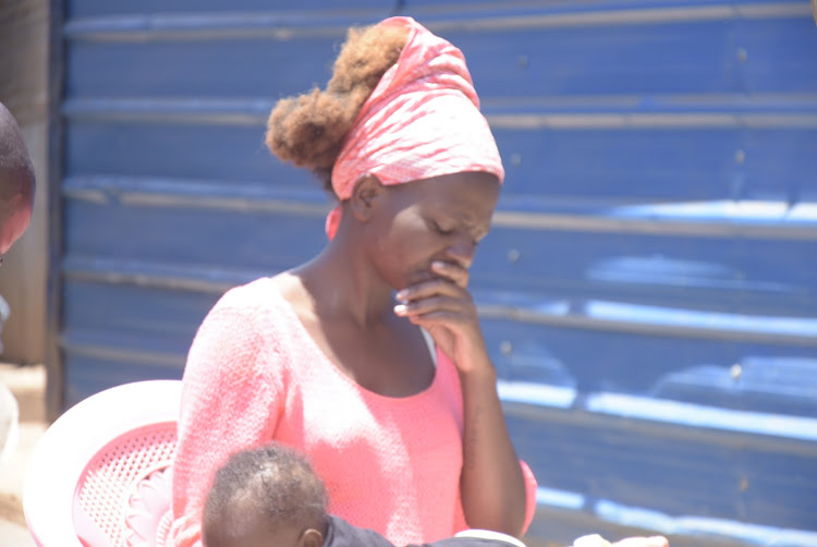 Lydia Wangui, the widow of Christopher Kariuki at their home in Kiandutu, Thika on Monday.