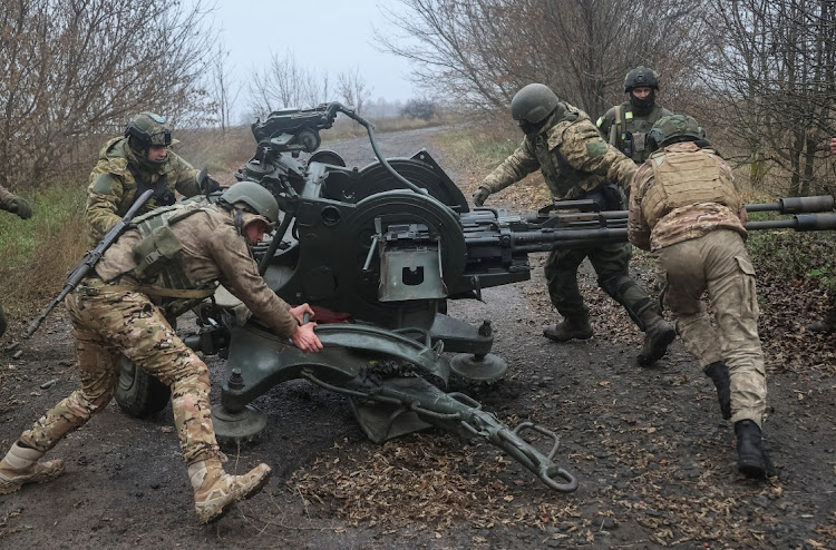 Ukrainian servicemen work with a ZU-23-2 anti-aircraft cannon at a position near a front line in the Kharkiv region. Picture: REUTERS