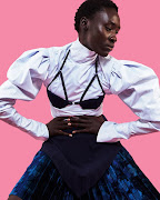 Thebe Magugu volume-sleeve shirt with bralette and an asymmetrical pleated skirt. 