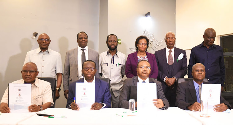 Vice chancellors of four universities and LREB officials at the signing ceremony of the MoU in Kisumu on Monday