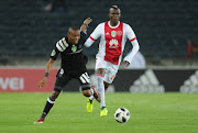 Gladwin Shitolo of pirates in action with Tendai Ndoro of Ajax during the Nedbank Cup Last 32 match between Orlando Pirates and Ajax Cape Town at Orlando Stadium on February 10, 2018 in Johannesburg, South Africa. 