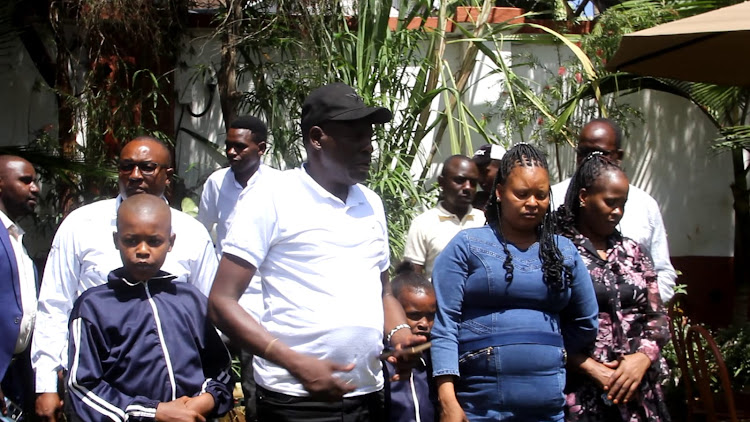 Businessman Moses Lichoro with his two wives at a Hotel in Meru town on Wednesday, February 21, 2024. He claims goons invaded his home, killed a workers, torched his vehicle and mansion and cut Miraa plantation all valued at more than Sh50M.