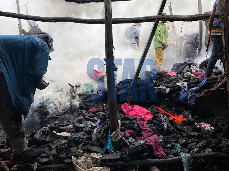 Gikomba traders salvage what is left after the morning inferno on August 6, 2021.