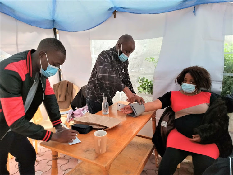 Lucy Wanjiru undergoes several medical tests at her Syokimau home on Sunday evening after she complaigned of intense fatigue and stress.