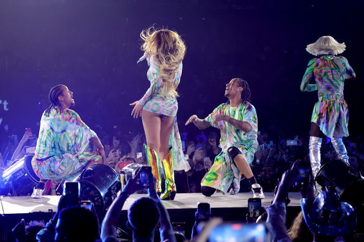 Beyonce in David Korma with the famed Les Twins performers.