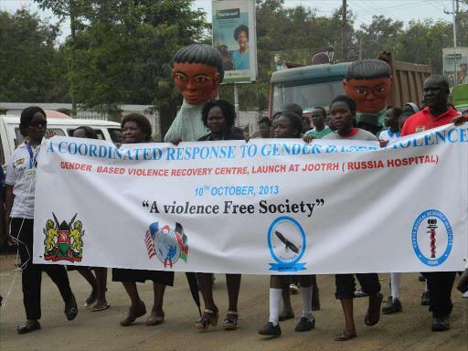 Gender activists march in the streets of Kisumu during the launch of Gender-Based Violence Recovery Centre