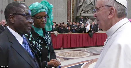 Pope Francis meets and shakes hands with President Robert Mugabe and his wife Grace in the Vatican on his first official day in ministry. file photo