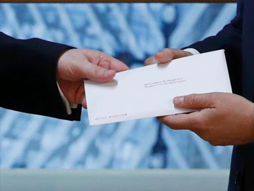 Britain's permanent representative to the European Union Tim Barrow delivers British Prime Minister Theresa May's Brexit letter in notice of the UK's intention to leave the bloc under Article 50 of the EU's Lisbon Treaty to EU Council President Donald Tusk in Brussels, Belgium March 29, 2017. REUTERS