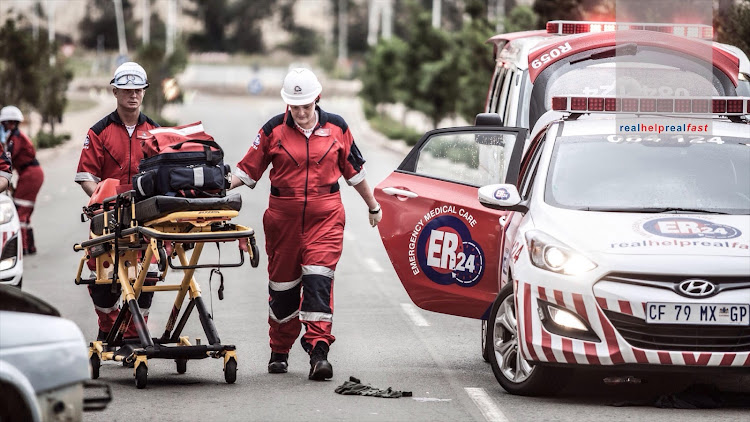 Paramedics found three men lying in the middle of Currie road.