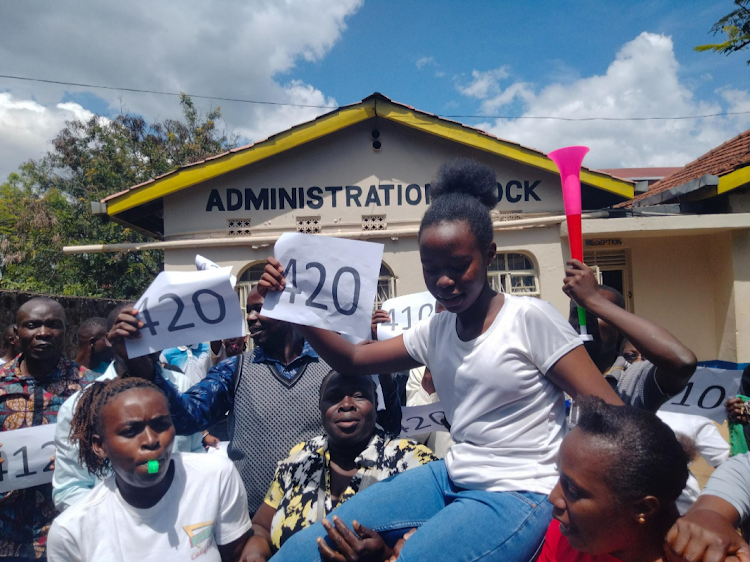 Students at Golden Elites School celebrate the top candidate who scored 420 marks in 2023 KCPE exams.