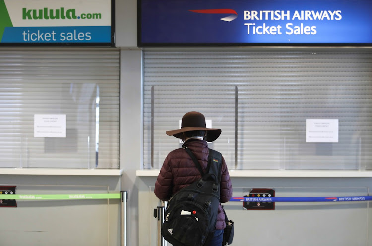 A message to passengers at the counter of Kulula and British Airways at Cape town International. Comair apologises to customers for grounding flights.