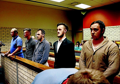 Stephe n Nel, DJ van R ooyen, Marius Harding, Oc kert Muller and Joshua Scholtz appeared in the Pretoria North Magistrate's Court yesterday for their alleged assault of a couple at a KFC outlet in Pretoria . / Phill Magakoe