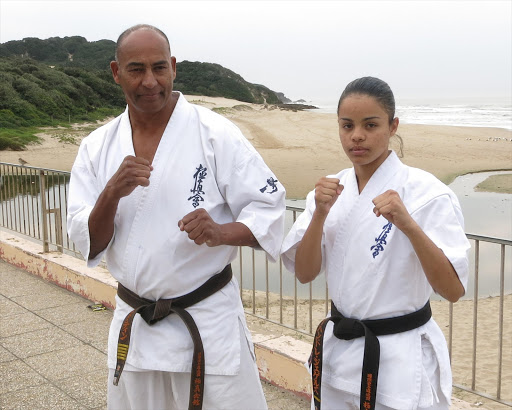 LUCKY ESCAPE: Stephen Martin, left, and reigning South Africa U55kg karate champion Leighandre Jegels, continue their training sessions. In the background are the dunes where the attack took place. Picture: PETER MARTIN