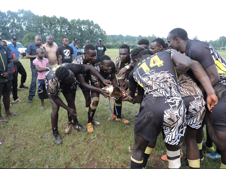 MMUST players celebrate with their trophy after winning the third Kusa title