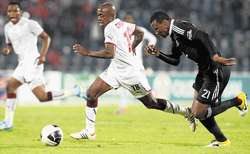 Bennett Chenene of Moroka Swallows on the offensive as Orlando Pirates defender Siyabonga Sangweni tries to close him down during the PSL encounter at Dobsonville stadium in Soweto last night. The match ended 0-0 Picture: SYDNEY SESHIBEDI