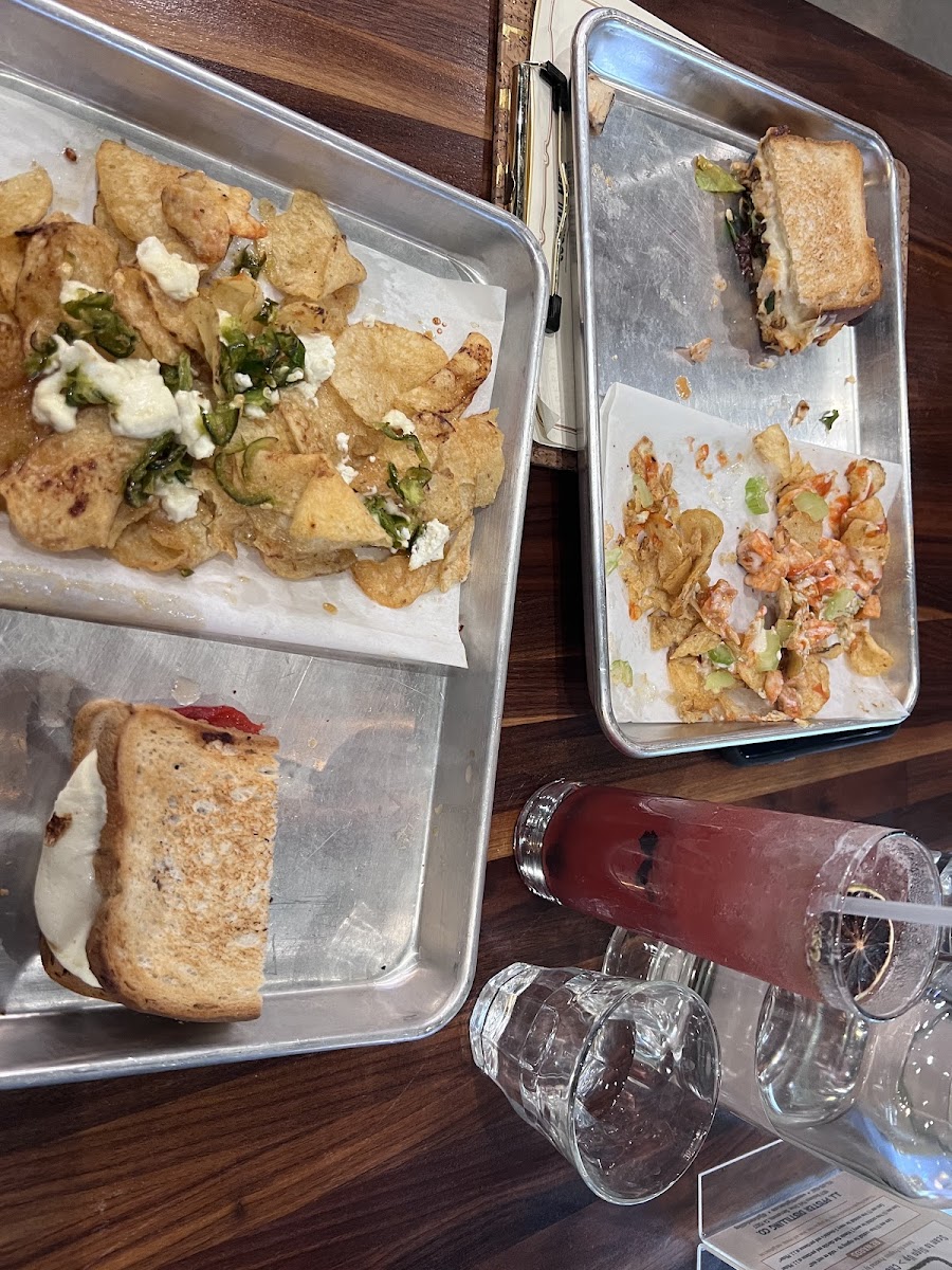 The plate to the left is the GF veggie panini (bread substitution since they were out of their normal bread for the GF panini) and the Jalapeno honey dirty chips. The right one is the GF Buffalo Chicken panini with Buffalo Chicken dirty chips.