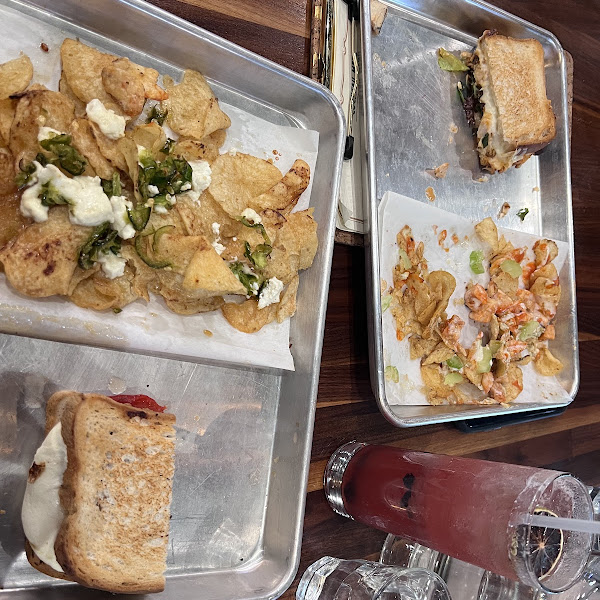 The plate to the left is the GF veggie panini (bread substitution since they were out of their normal bread for the GF panini) and the Jalapeno honey dirty chips. The right one is the GF Buffalo Chicken panini with Buffalo Chicken dirty chips.