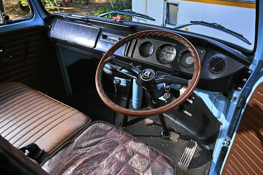 The sparse interior of the 1971 T2 Kombi. The previous owner put a Beetle Wolfsburg hooter button on the T2’s steering wheel.