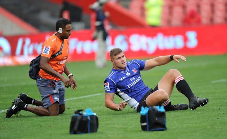 Malcolm Marx of the Emirates Lions receives medical attention during the Super Rugby match against the Sunwolves at Emirates Airline Park on March 17, 2018 in Johannesburg, South Africa.