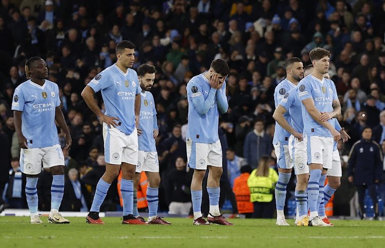 Manchester City players after their penalty shootout loss in the Champions League quarterfinal, second leg against Real Madrid at Etihad Stadium, Manchester on April 17, 2024