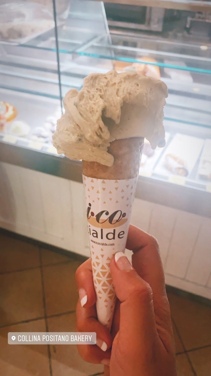 pistachio gelato in a gf cone