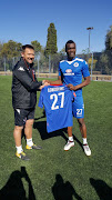 New SuperSport United's Nigerian defender Azubuike Egwuekwe posing for a photo with head coach Eric Tinkler on Thursday 24 August 2017. 